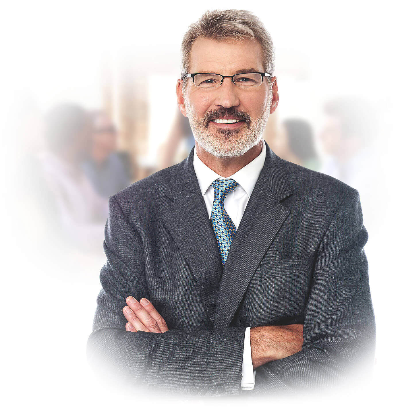 Confident middle-aged businessman in a suit with glasses smiling, standing with arms crossed.