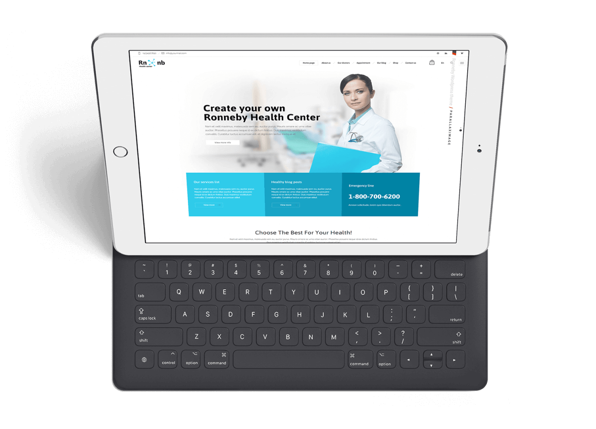 Tablet displaying a medical website with a doctor image and a keyboard attached, on a white surface.