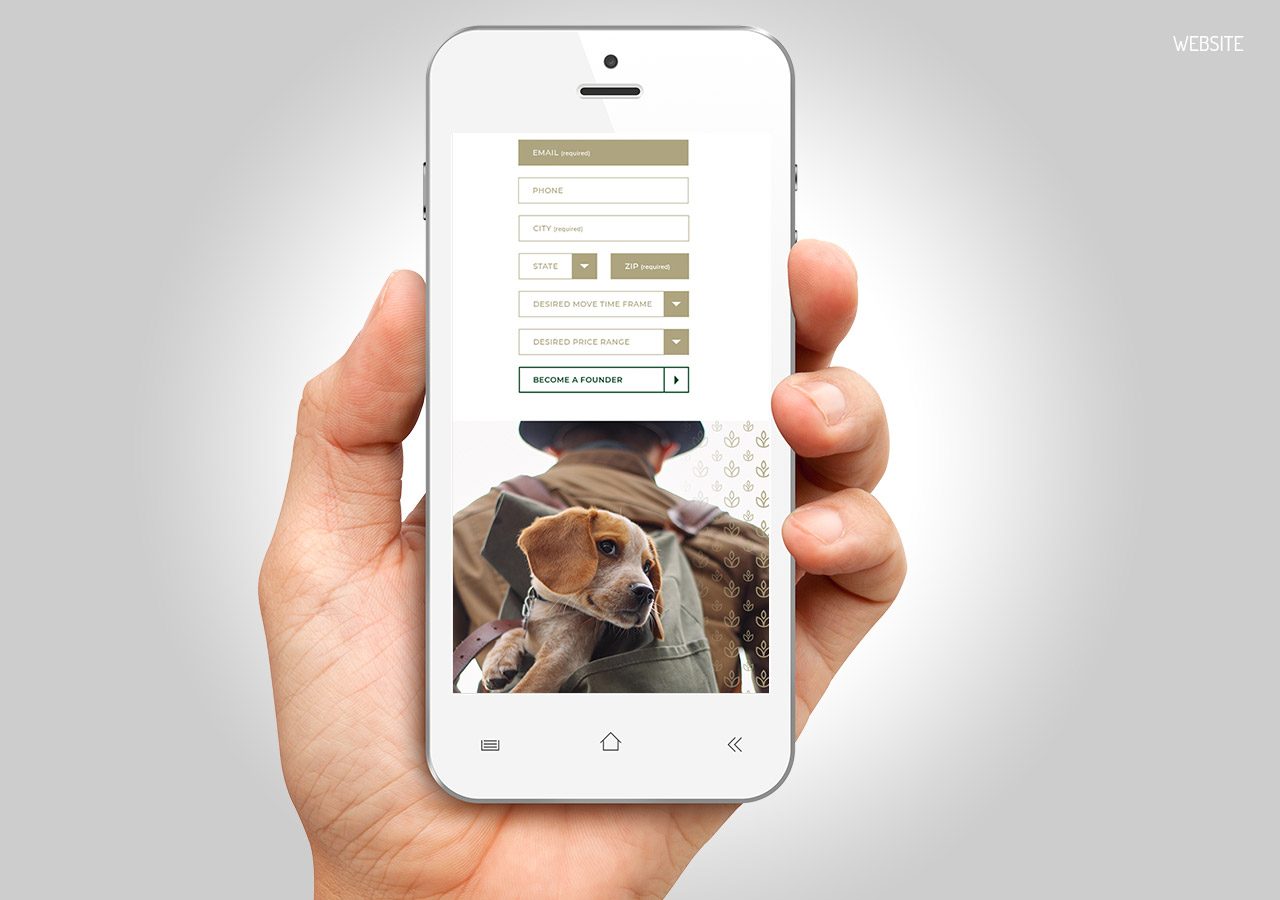 A hand holding a smartphone displaying a form and a picture of a dog wearing a collar.