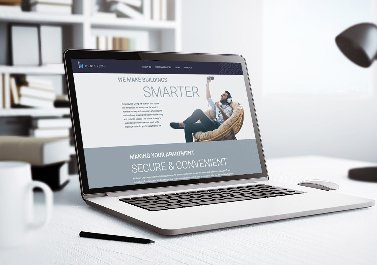 A laptop on a desk displaying a website with a person reclining and the text about working smarter and debt management.
