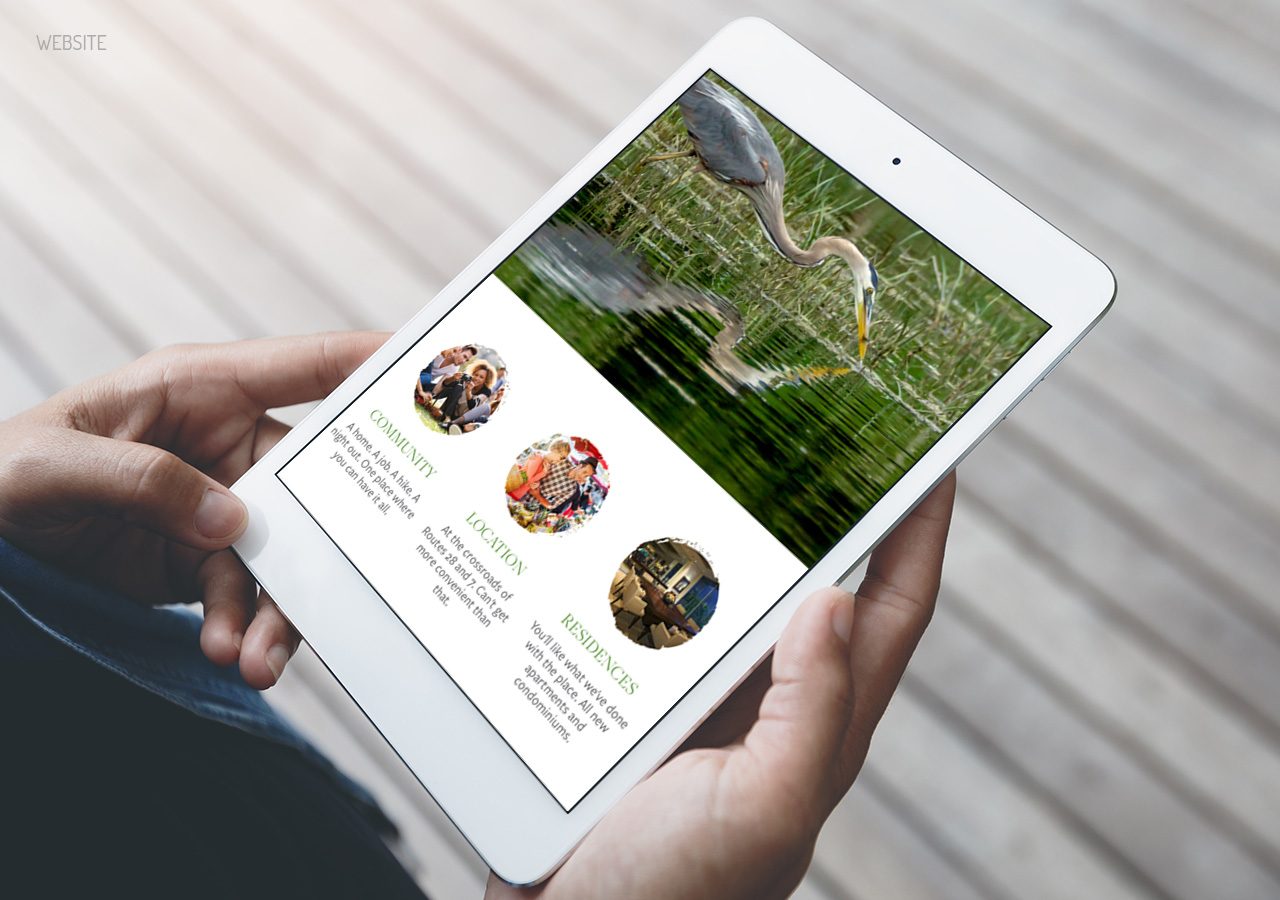 Person holding a tablet displaying a travel-themed webpage with scenic photos and destination descriptions.