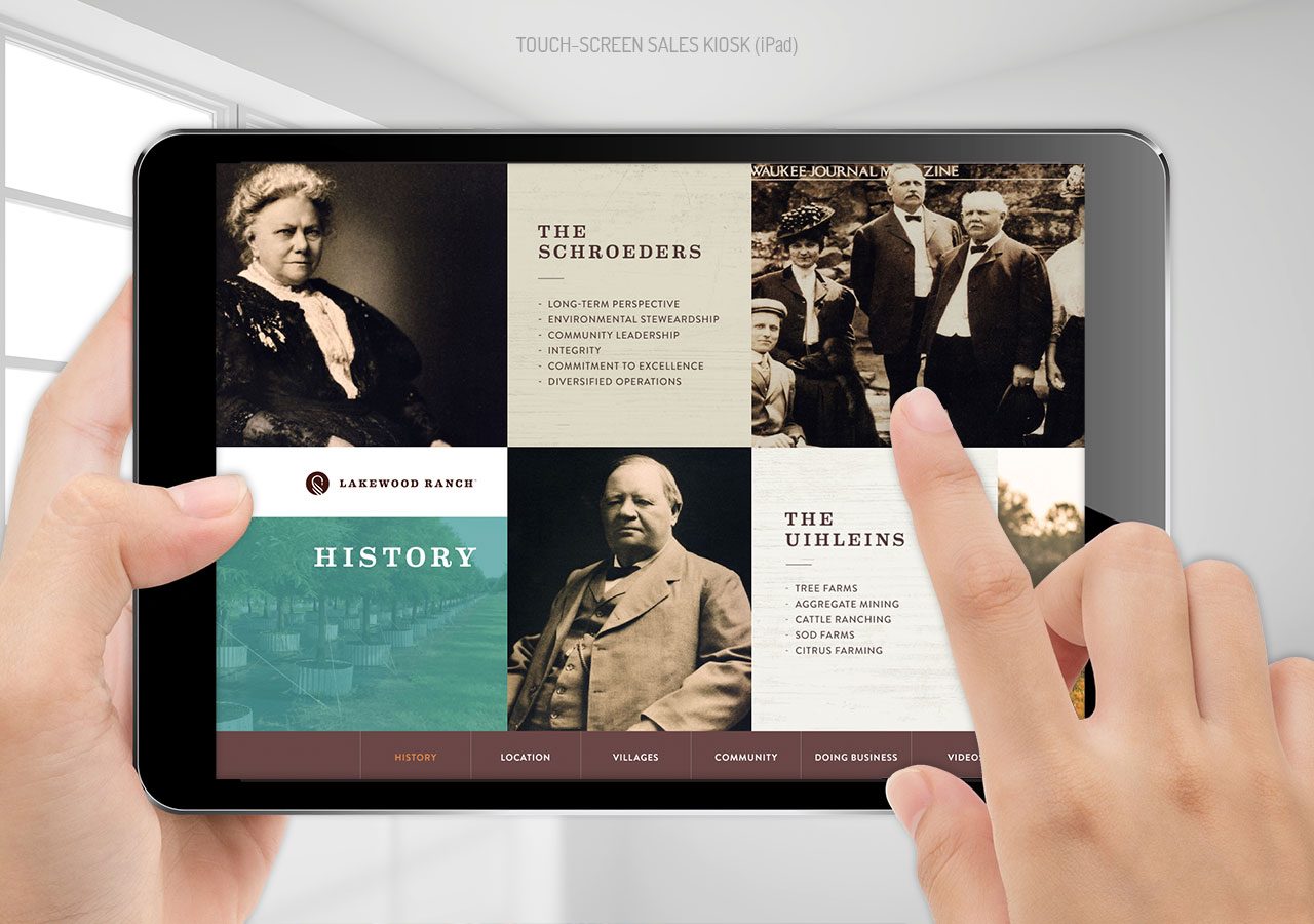 Person interacting with a touchscreen displaying historical figures and educational content about history and science.