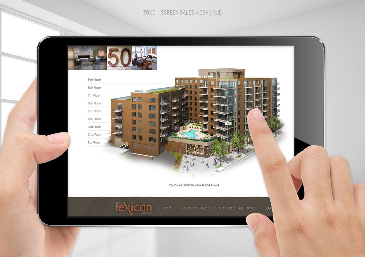 A person interacts with a tablet displaying a 3D architectural model of a modern residential building complex.