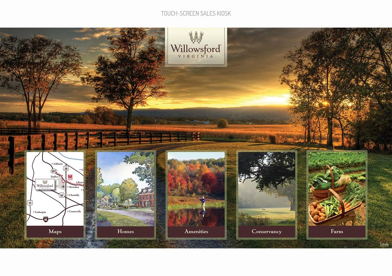 A scenic sunset over a countryside landscape with four booklets about Wildwood and local attractions displayed below.